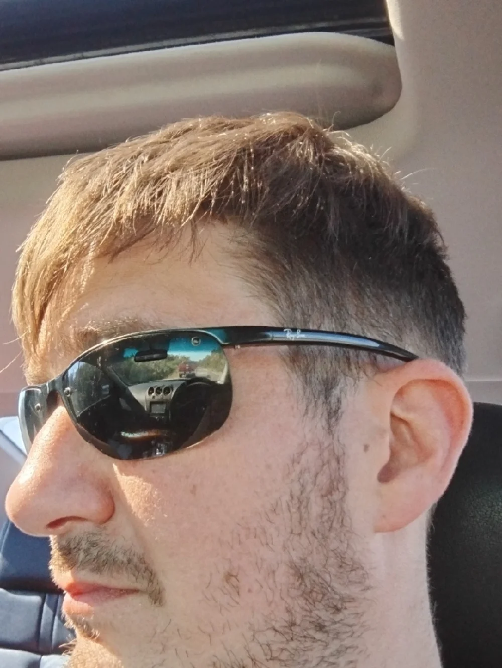 Ray-Ban Black Frame Sunglasses with Reflective Gray-Green Lenses